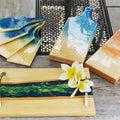 Hardwood serving boards with blue and sunset resin rivers