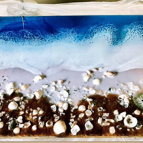 Round ocean resin wall art in blue and white